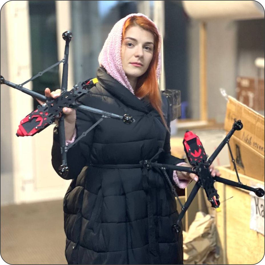 Volunteer holding drones